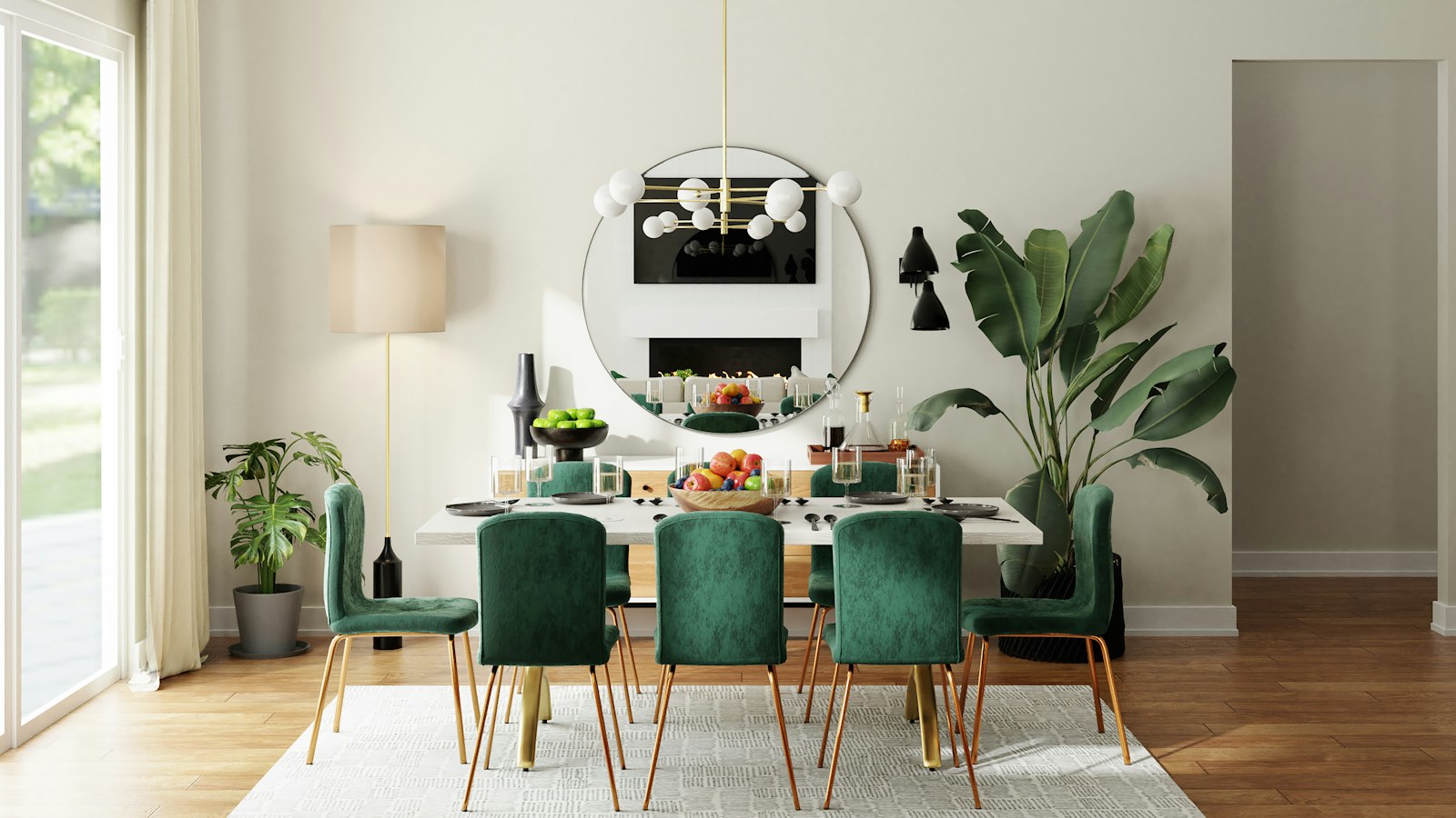 Dining table with emerald velvet chairs and a brass chandelier